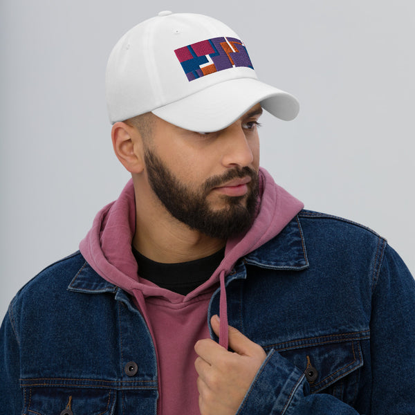 Colorful pink, orange, purple and blue geometric shapes patterned rectangular logo on this white colored dad hat