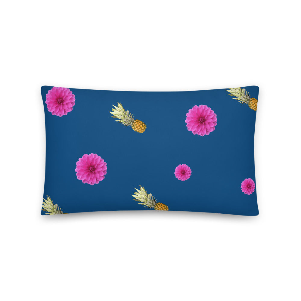 Pink flowers and pineapples patterned cushion or pillow in blue background