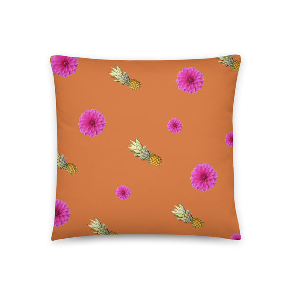 Pink flowers and pineapples patterned cushion or pillow in orange background