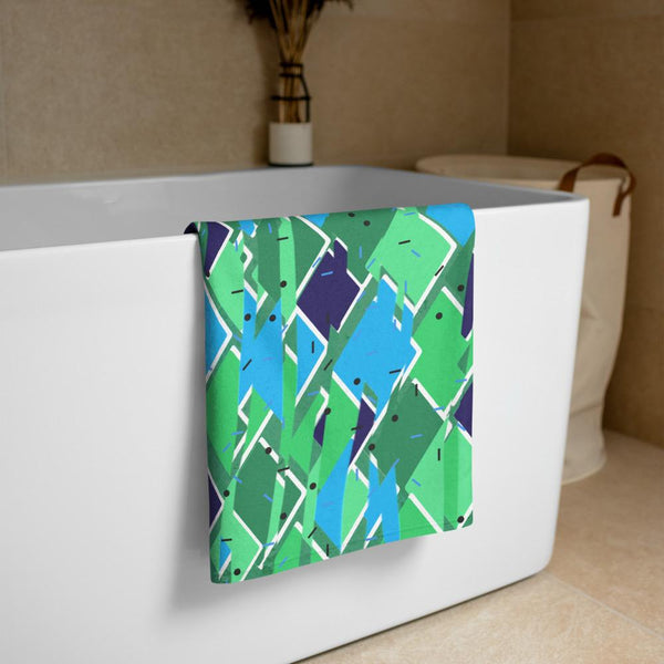Large turquoise, green and sage colored diagonal pattern on this bathroom towel
