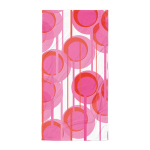This Mid-Century Modern style bathroom and beach towel consists of colorful geometric circular shapes in various tones of pink, connected vertically by narrow tentacles to form and almost hanging mobile type abstract circular pattern on a white background