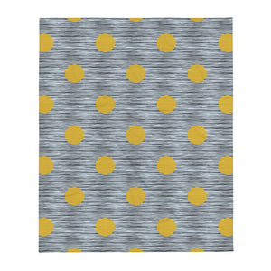 This striking Mid-Century Modern style couch throw design consists of a series of mustard yellow coloured irregular dot shapes against black, grey and blue crisscross design background