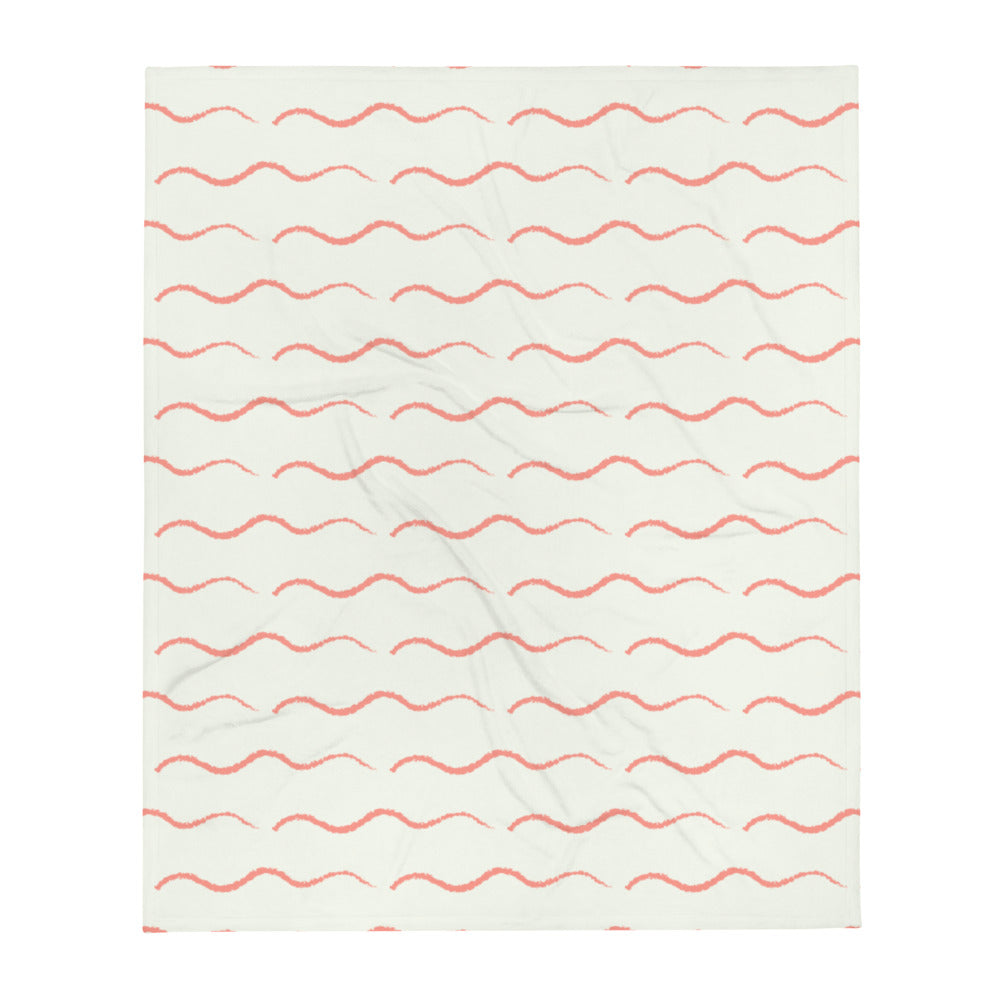 This retro style couch throw consists of a series of horizontal salmon pink or peach wave shapes against a pale cream background
