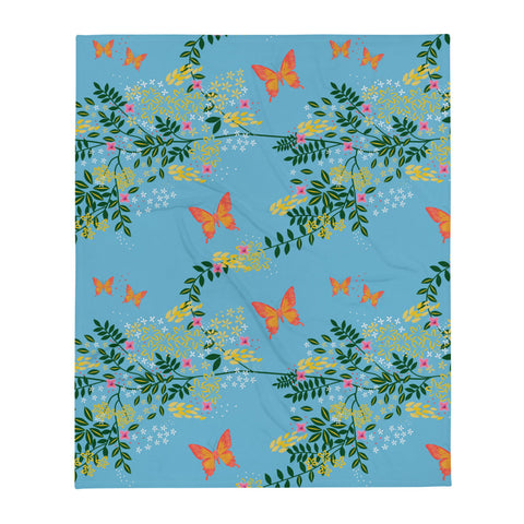 Cottagecore themed vintage style patterned throw blanket in butterfly woodland theme on a pale blue background by BillingtonPix