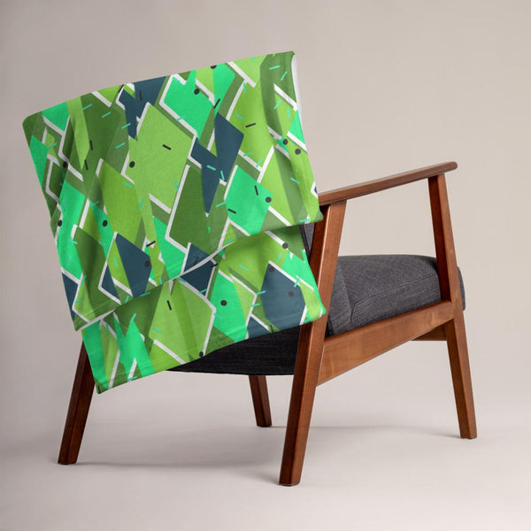 Green diagonal patterned contemporary retro 60s style throw blanket with touches of 80s Memphis and an abstract vertical distorted effect