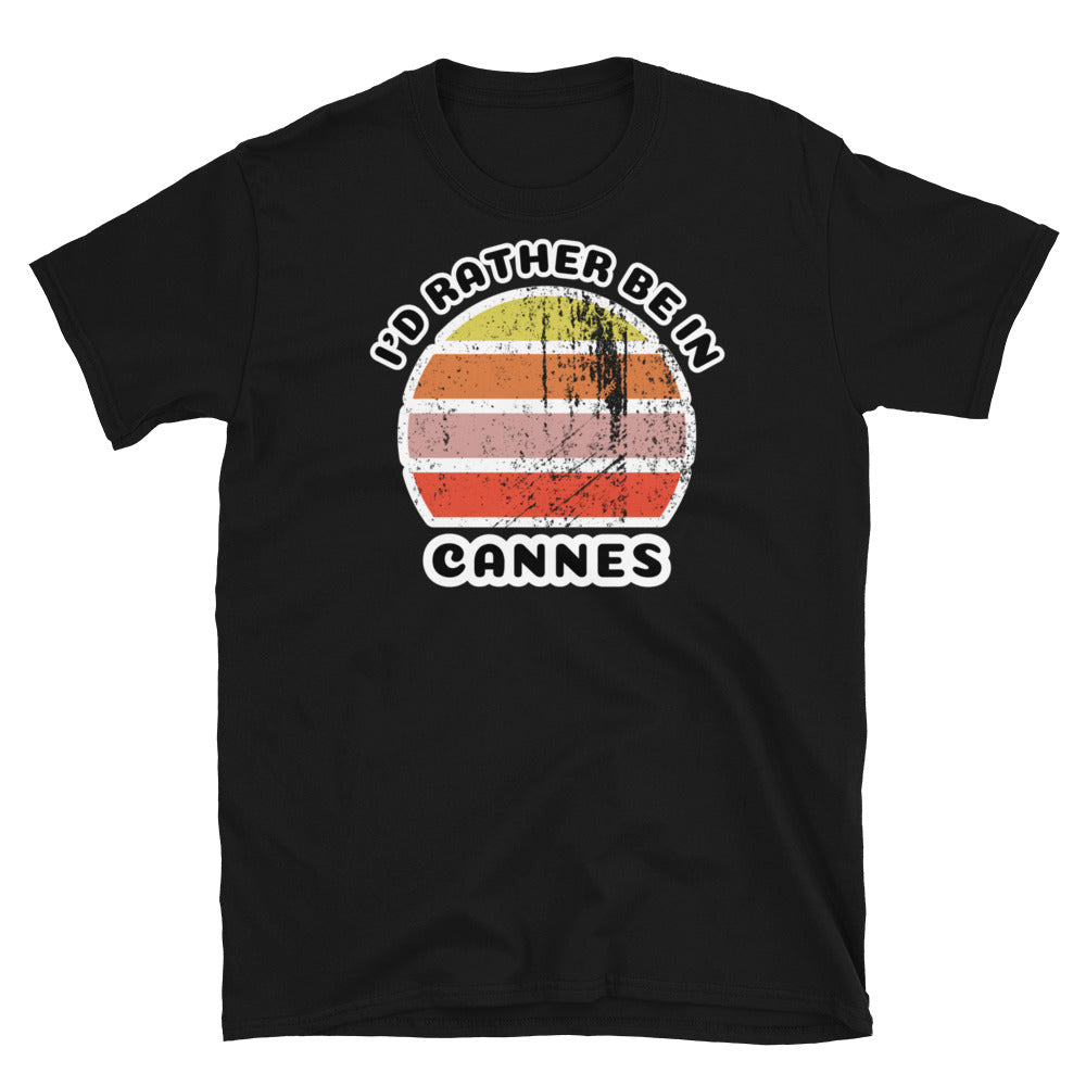 Vintage distressed style abstract retro sunset in yellow, orange, pink and scarlet with the words I'd Rather Be In above and the place name Cannes beneath on this black cotton t-shirt