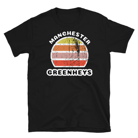 Distressed style abstract retro sunset graphic in yellow, orange, pink and scarlet stripes. The name of Manchester is displayed at the top wrapped around the sunset. Below the retro sunset design is the famous Manchester place name of Greenheys on this black cotton t-shirt.