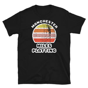 Distressed style abstract retro sunset graphic in yellow, orange, pink and scarlet stripes. The name of Manchester is displayed at the top wrapped around the sunset. Below the retro sunset design is the famous Manchester place name of Miles Platting on this black cotton t-shirt.