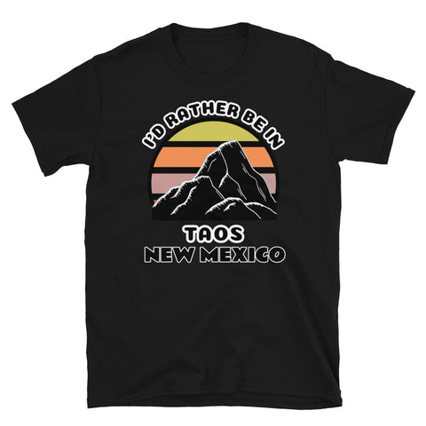 Taos New Mexico vintage sunset mountain scene in silhouette, surrounded by the words I'd Rather Be In on top and Taos New Mexico below on this black cotton t-shirt