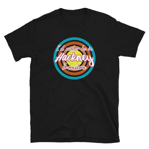 Hackney urban vintage style graphic in turquoise, orange, pink and yellow concentric circles with the slogan I'd rather be in Hackney London across the front in retro style font on this black cotton t-shirt