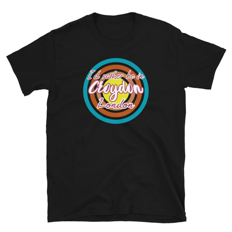Croydon urban city vintage style graphic in turquoise, orange, pink and yellow concentric circles with the slogan I'd rather be in Croydon London across the front in retro vintage style font on this black cotton t-shirt