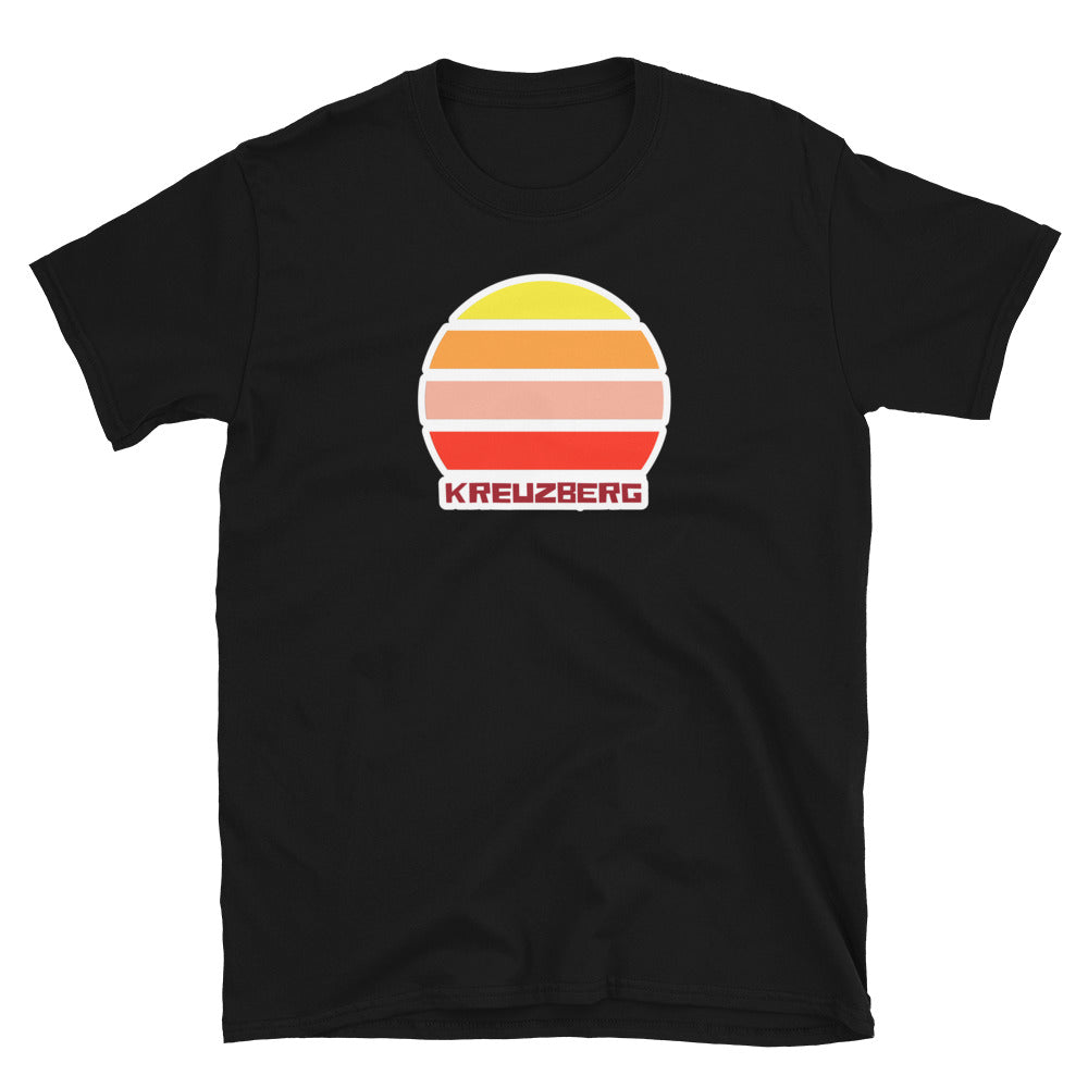 Kreuzberg Berlin LGBT themed t-shirt with a vintage sunset graphic in yellow, orange, pink and scarlet and the place name Kreuzberg  beneath on this black cotton t-shirt by BillingtonPix