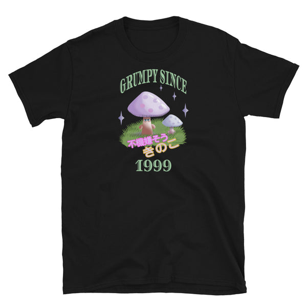 Cute Japanese Kawaii style graphic tee with a cottagecore style theme of woodland mushrooms. Muted tones in a retro vintage 90s Japanese style in pale pinks, mauves and green. These are grumpy mushrooms and the slogan Grumpy Since 1999 and 不機嫌そうなキノコ describe this black cotton t-shirt by BillingtonPix