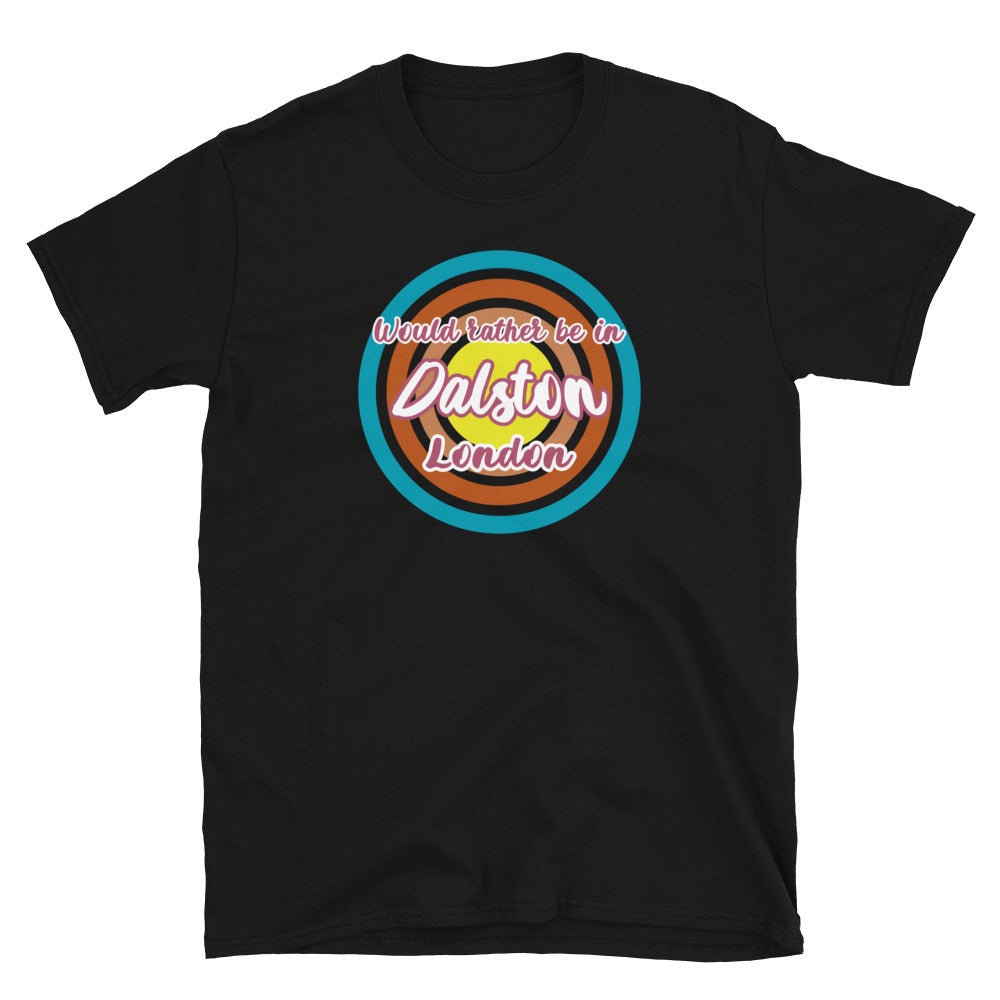 Dalston urban city vintage style graphic in turquoise, orange, pink and yellow concentric circles with the slogan I'd rather be in Dalston London across the front in retro style font on this black cotton t-shirt