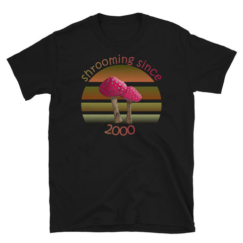 Shrooming since 2000 cute Goblincore style design with two red fly agaric mushrooms with distressed look against a multi-toned nature colour palette abstract vintage sunset design on this black cotton t-shirt by BillingtonPix