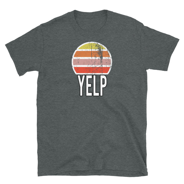 Retro vintage style sunset graphic in yellow, orange, pink and scarlet with the slogan word YELP in block caps below on this dark grey cotton t-shirt by BillingtonPix
