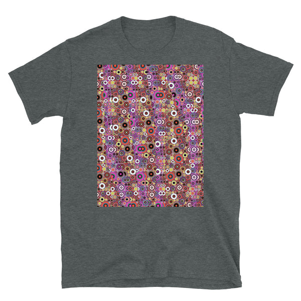 60s retro style aesthetic circular design of multiple different orange colored circles with almost psychedelic effect. Vertical pink filtered strips run across the front providing a contrasting palette with this t-shirt.
