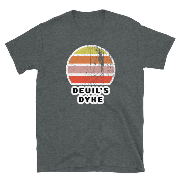 Features a distressed abstract retro sunset graphic in yellow, orange, pink and scarlet stripes rising up from the famous Devil's Dyke place name in Brighton on this dakr heather t-shirt