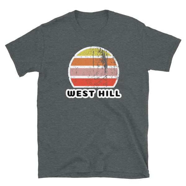 Distressed style abstract retro sunset graphic in yellow, orange, pink and scarlet stripes above the famous Brighton place name of West Hill on this dark heather t-shirt