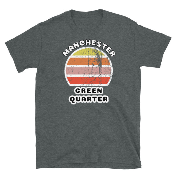 Distressed style abstract retro sunset graphic in yellow, orange, pink and scarlet stripes. The name of Manchester is displayed at the top wrapped around the sunset. Below the retro sunset design is the famous Manchester place name of Green Quarter on this dark grey cotton t-shirt. 
