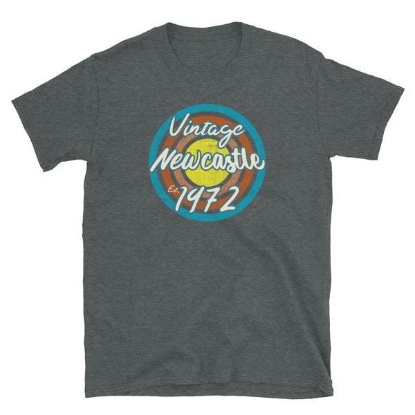 Vintage Newcastle Est. 1972 retro vintage grunge style design in turquoise, orange, pink and yellow tones for birthday gift ideas on this dark grey cotton t-shirt