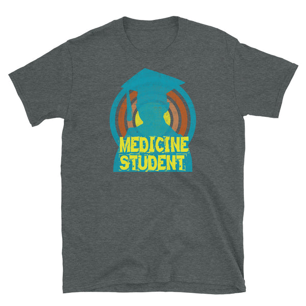 Medicine Student novelty tee with a distressed style turquoise silhouetted student against a concentric circular design and the words Medicine Student in bold yellow font on this dark grey cotton fun graphic t-shirt by BillingtonPix