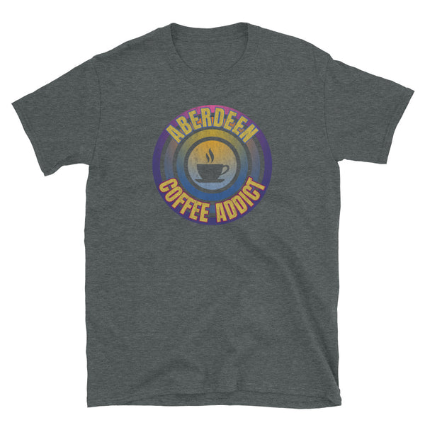 Concentric circular design of retro 80s metallic colours and the slogan Aberdeen Coffee Addict with a coffee cup silhouette in the centre. Distressed and dirty style image for a vintage Retrowave look on this dark grey cotton t-shirt by BillingtonPix