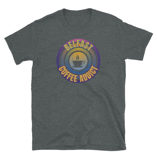 Concentric circular design of retro 80s metallic colours and the slogan Belfast Coffee Addict with a coffee cup silhouette in the centre. Distressed and dirty style image for a vintage Retrowave look on this dark grey cotton t-shirt by BillingtonPix