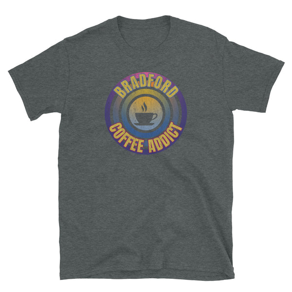 Concentric circular design of retro 80s metallic colours and the slogan Bradford Coffee Addict with a coffee cup silhouette in the centre. Distressed and dirty style image for a vintage Retrowave look on this dark grey cotton t-shirt by BillingtonPix