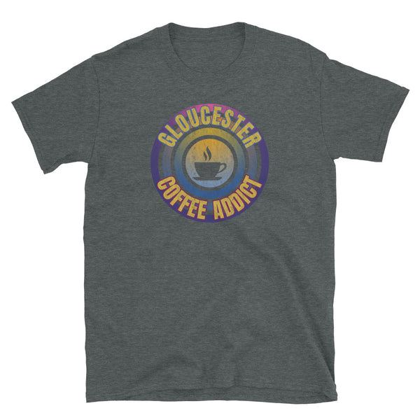 Concentric circular design of retro 80s metallic colours and the slogan Gloucester Coffee Addict with a coffee cup silhouette in the centre. Distressed and dirty style image for a vintage Retrowave look on this dark grey cotton t-shirt by BillingtonPix