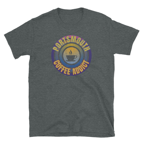 Concentric circular design of retro 80s metallic colours and the slogan Portsmouth Coffee Addict with a coffee cup silhouette in the centre. Distressed and dirty style image for a vintage Retrowave look on this dark grey cotton t-shirt by BillingtonPix