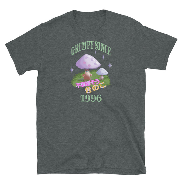 Cute Japanese Kawaii style graphic tee with a cottagecore style theme of woodland mushrooms. Muted tones in a retro vintage 90s Japanese style in pale pinks, mauves and green. These are grumpy mushrooms and the slogan Grumpy Since 1996 and 不機嫌そうなキノコ describe this dark heather cotton t-shirt by BillingtonPix