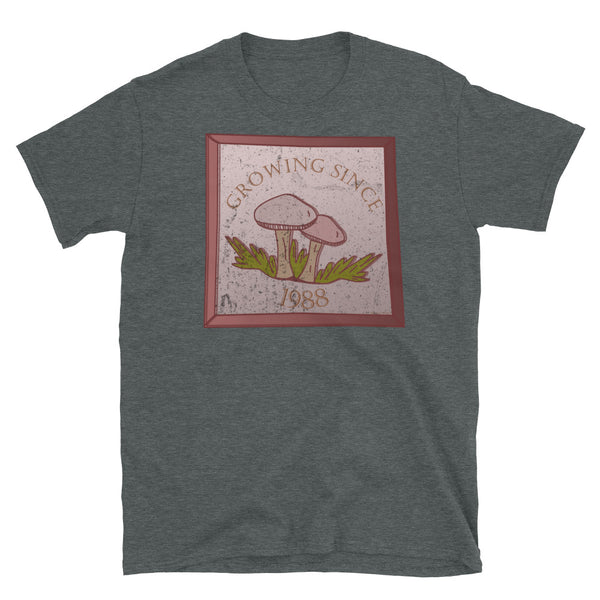 Growing since 1988 cute Goblincore style design with two mushrooms in muted tones and a glass framed effect with distressed look on this dark heather cotton t-shirt by BillingtonPix
