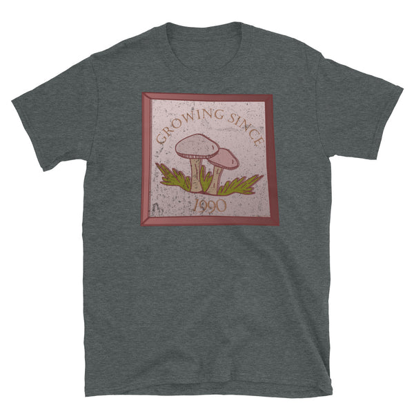 Growing since 1990 cute Goblincore style design with two mushrooms in muted tones and a glass framed effect with distressed look on this dark heather cotton t-shirt by BillingtonPix