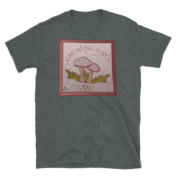 Growing since 1992 cute Goblincore style design with two mushrooms in muted tones and a glass framed effect with distressed look on this dark heather cotton t-shirt by BillingtonPix