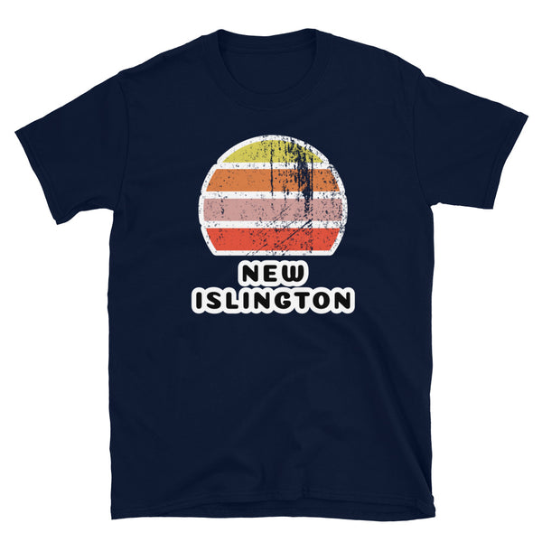 Features a distressed abstract retro sunset graphic in yellow, orange, pink and scarlet stripes rising up from the famous Manchester place name of New Islington on this navy t-shirt