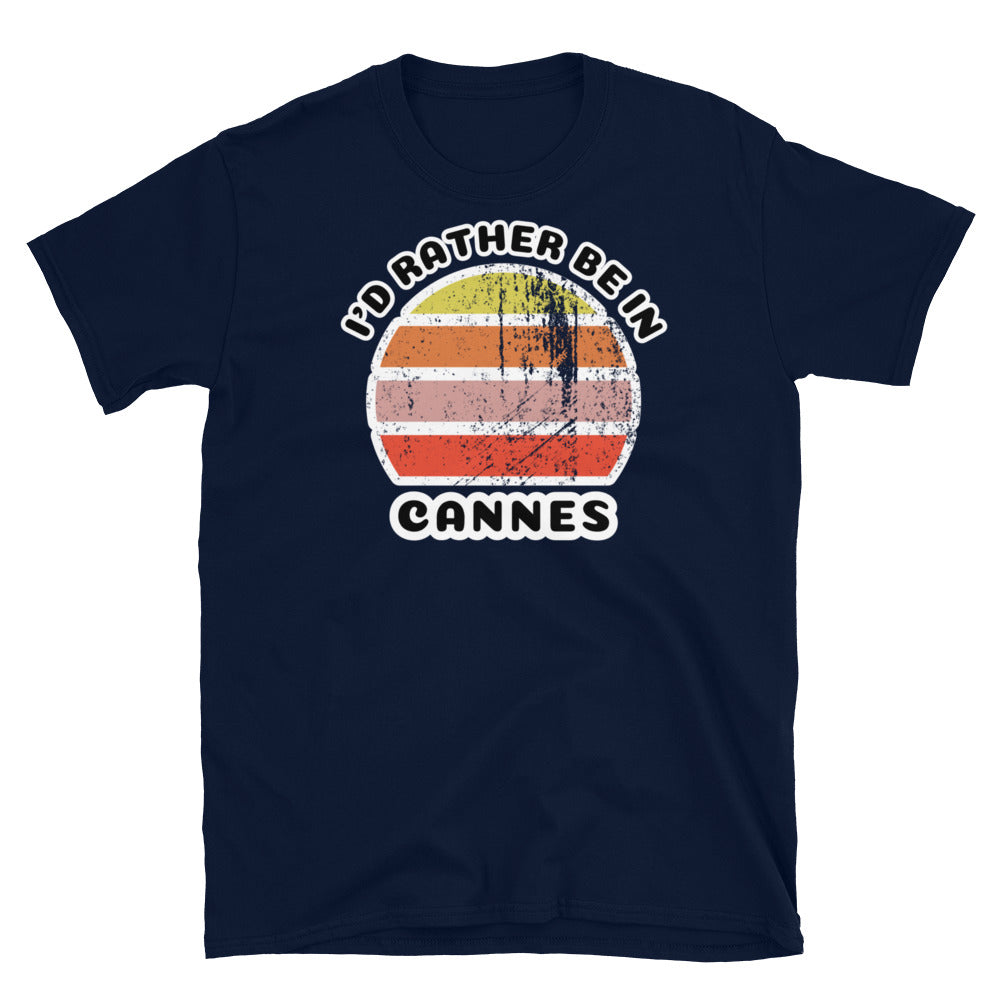 Vintage distressed style abstract retro sunset in yellow, orange, pink and scarlet with the words I'd Rather Be In above and the place name Cannes beneath on this navy cotton t-shirt