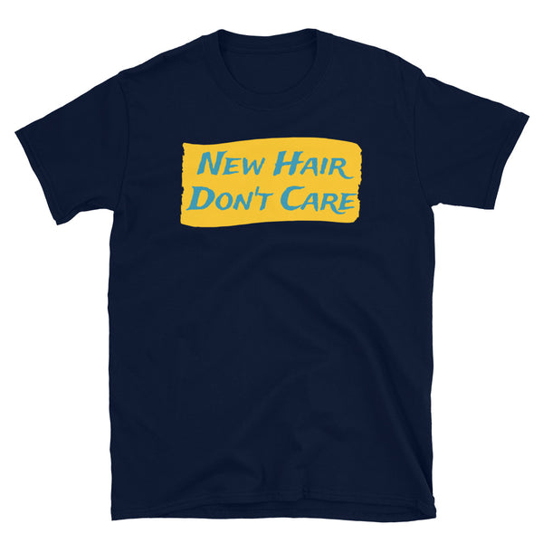 Funny slogan New Hair Don't Care in turquoise font on a splash of orange colour on this navy cotton tee