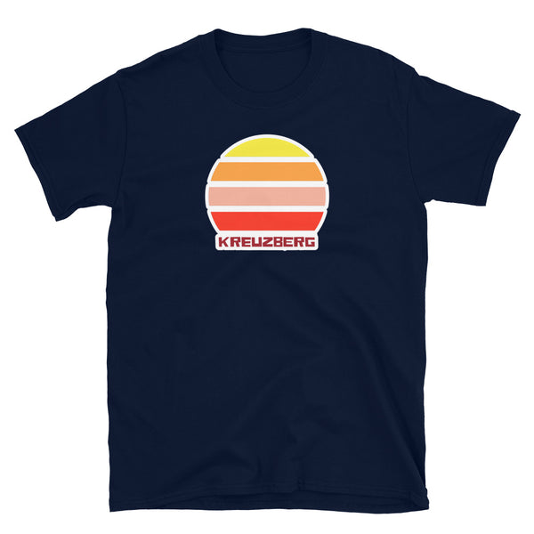 Kreuzberg Berlin LGBT themed t-shirt with a vintage sunset graphic in yellow, orange, pink and scarlet and the place name Kreuzberg  beneath on this navy cotton t-shirt by BillingtonPix