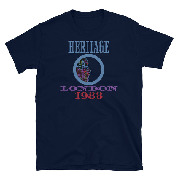 Graphic t-shirt with a patterned profile face in abstract design, tones of blue, green, purple, red, in circular format, with the words Heritage London 1988 in blue, purple and red on this navy cotton t-shirt by BillingtonPix