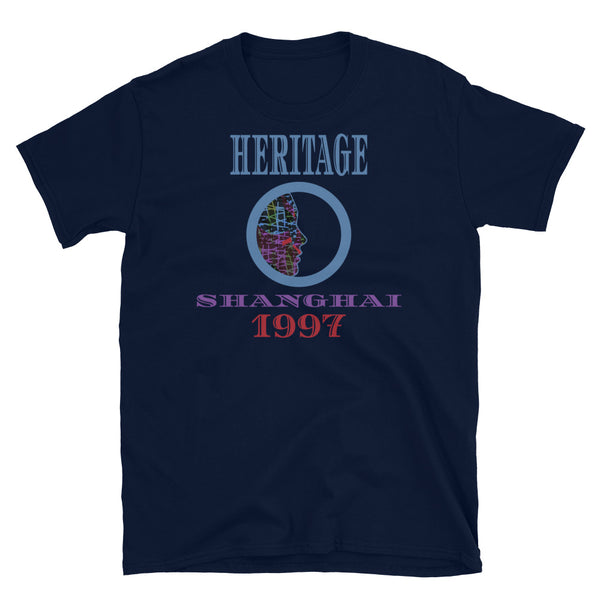 Graphic t-shirt with a patterned profile face in abstract design, tones of blue, green, purple, red, in circular format, with the words Heritage Shanghai 1997 in blue, purple and red on this navy cotton t-shirt by BillingtonPix