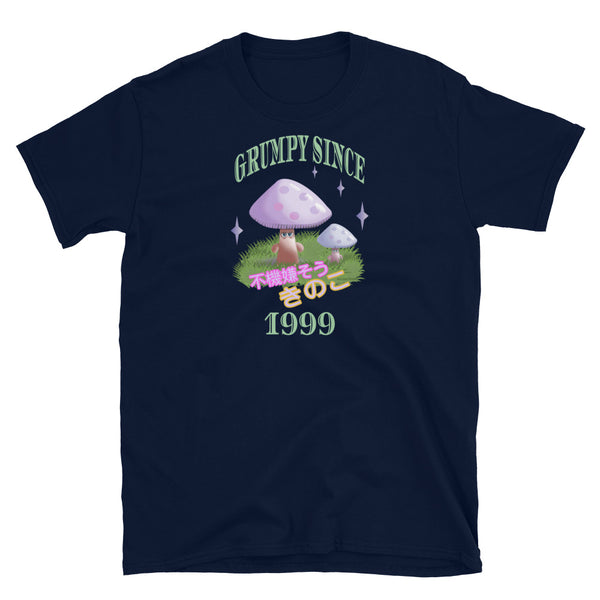 Cute Japanese Kawaii style graphic tee with a cottagecore style theme of woodland mushrooms. Muted tones in a retro vintage 90s Japanese style in pale pinks, mauves and green. These are grumpy mushrooms and the slogan Grumpy Since 1999 and 不機嫌そうなキノコ describe this navy cotton t-shirt by BillingtonPix
