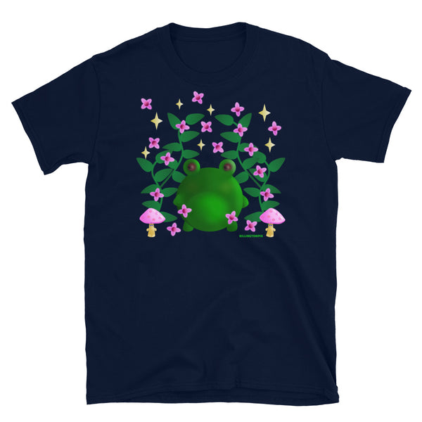 Cute kawaii green frog in this Cottagecore asesthetic graphic design. Features green leaves, pink blossom, grumpy mushrooms and stars in the sky on this navy cotton t-shirt by BillingtonPix