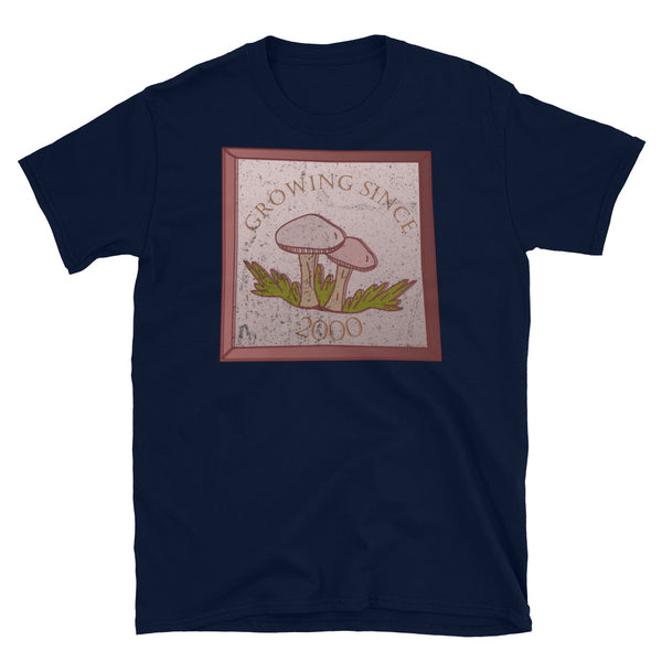 Growing since 2000 cute Goblincore style design with two mushrooms in muted tones and a glass framed effect with distressed look on this navy cotton t-shirt by BillingtonPix