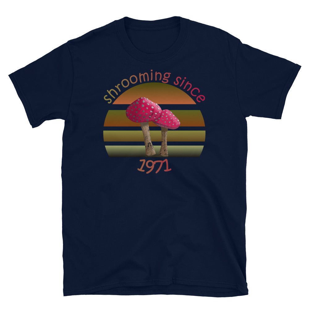 Shrooming since 1971 cute Goblincore style design with two red fly agaric mushrooms with distressed look against a multi-toned nature colour palette abstract vintage sunset design on this navy cotton t-shirt by BillingtonPix