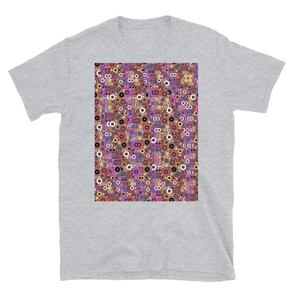 60s retro style aesthetic circular design of multiple different orange colored circles with almost psychedelic effect. Vertical pink filtered strips run across the front providing a contrasting palette with this t-shirt.