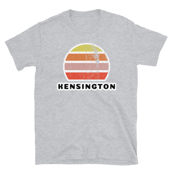 Vintage distressed style abstract retro sunset in yellow, orange, pink and scarlet with the name Kensington beneath on this sport grey t-shirt