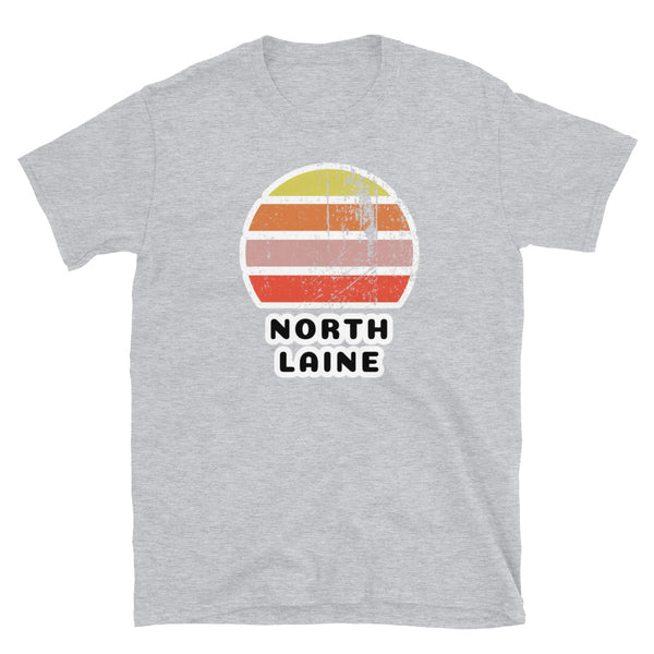 Features a distressed abstract retro sunset graphic in yellow, orange, pink and scarlet stripes rising up from the famous Brighton place name of North Laine on this sport grey t-shirt