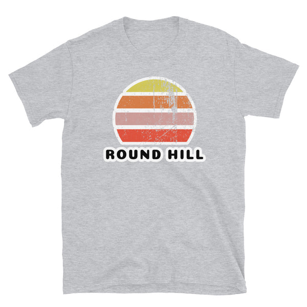 Distressed style abstract retro sunset graphic in yellow, orange, pink and scarlet stripes above the famous Brighton place name of Round Hill on this sport grey t-shirt