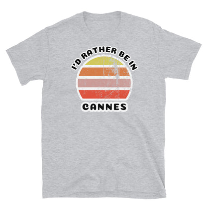 Vintage distressed style abstract retro sunset in yellow, orange, pink and scarlet with the words I'd Rather Be In above and the place name Cannes beneath on this sport grey t-shirt